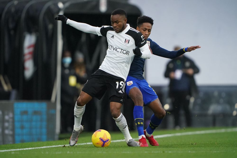 Ademola Lookman is barged over Ademola Lookman is barged over