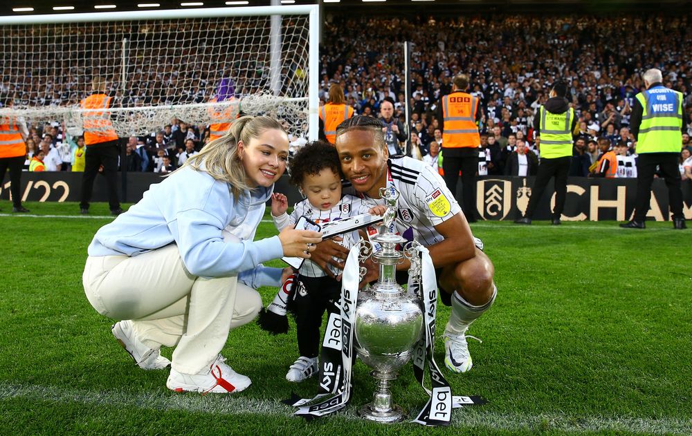 Bobby De Cordova-Reid celebrates winning the Championship title with his family Bobby De Cordova-Reid celebrates winning the Championship title with his family