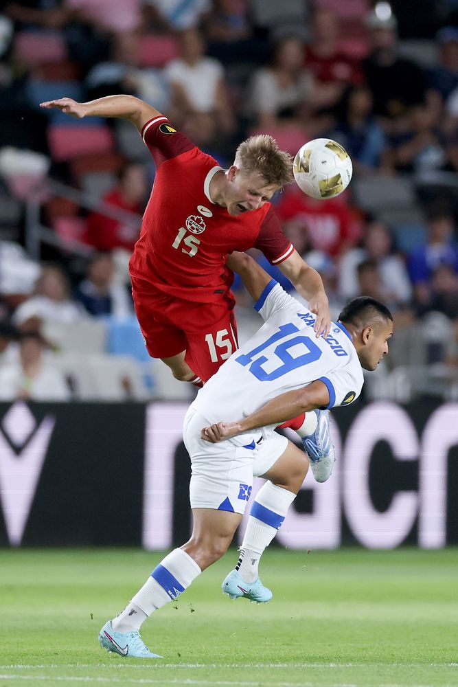 Luc De Fougerolles challenges for a header against El Salvador