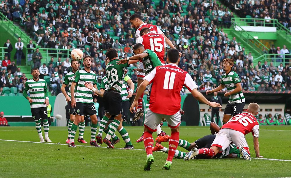 William Saliba heads in Arsenal's opener against Sporting