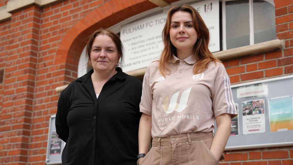 Mother and daughter duo, Emma and Harley, stand in front of Craven Cottage.