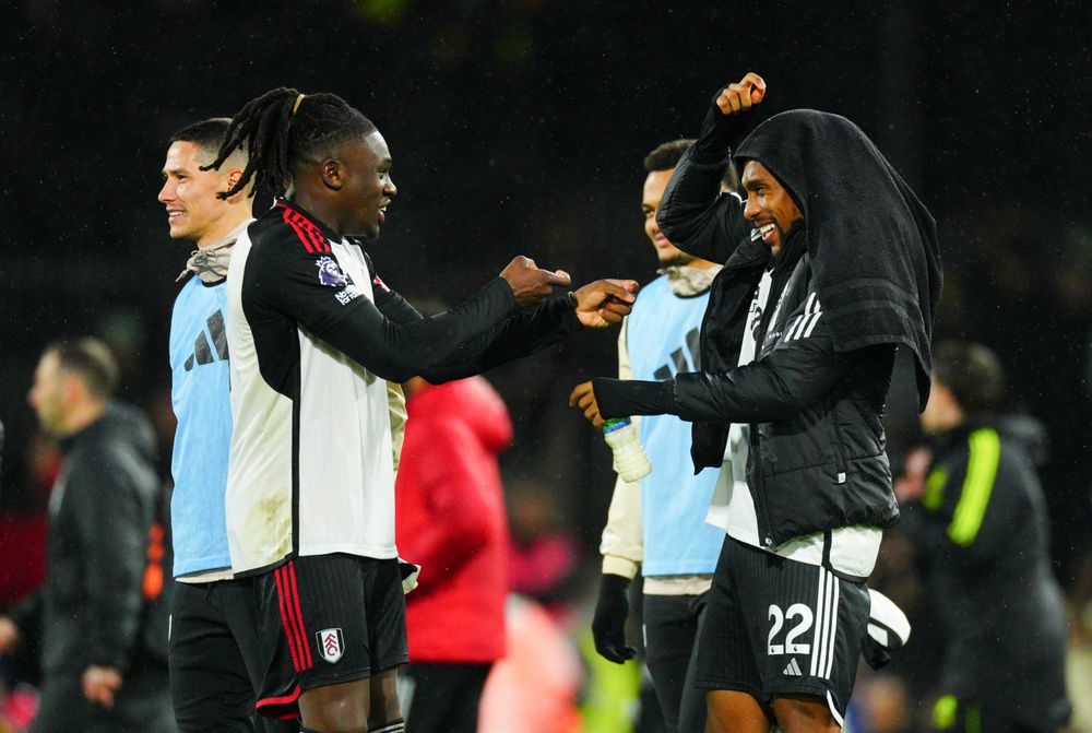 Calvin Bassey and Alex Iwobi celebrate at full-time Calvin Bassey and Alex Iwobi celebrate at full-time