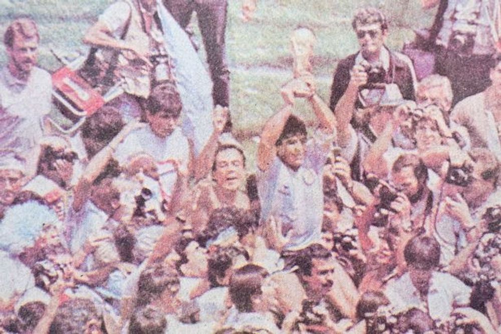 Duncan Coales finds himself in shot as Diego Maradona lifts the World Cup
