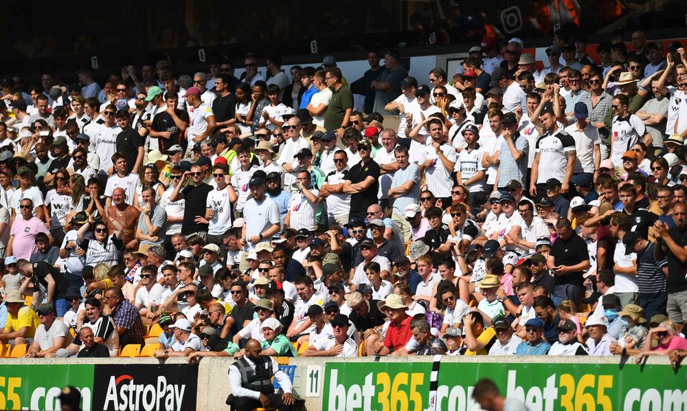 The Fulham fans in the baking sun at Molineux