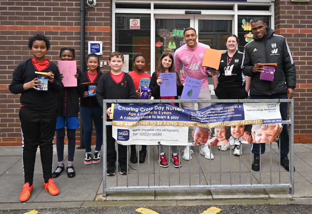 Carlos Vinicius and Issa Diop pose with students Carlos Vinicius and Issa Diop pose with students