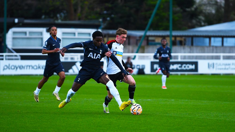 Fulham U21s forward Callum Osmand battles for the ball with a Tottenham player Fulham U21s forward Callum Osmand battles for the ball with a Tottenham player