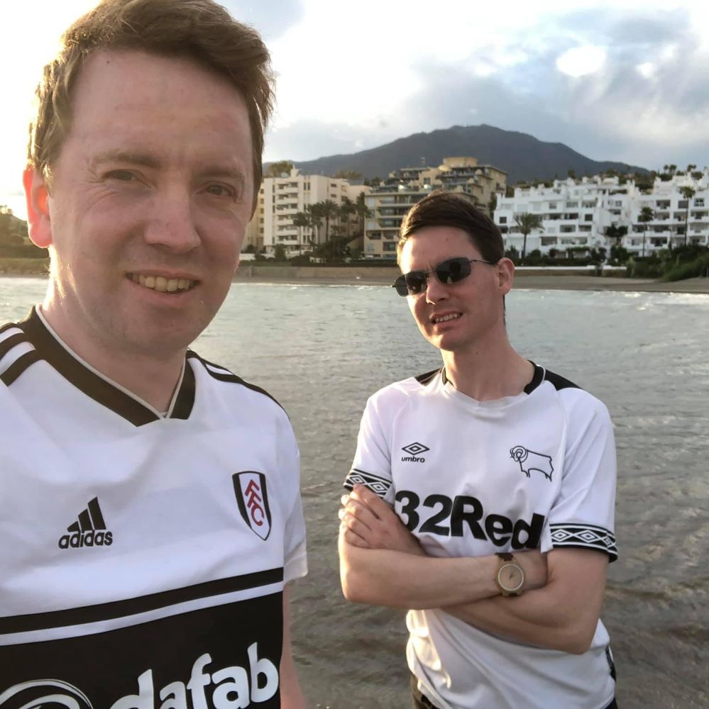 Fulham fan Barnaby and his partner Chris, a Derby supporter