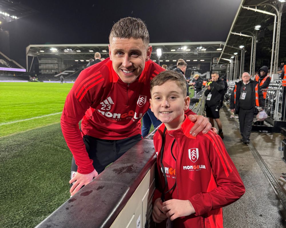 Alfie poses for a photo with Tom Cairney Alfie poses for a photo with Tom Cairney