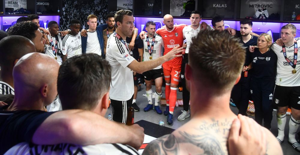 Kevin McDonald delivers a speech to players and staff in the Wembley changing room at full-time