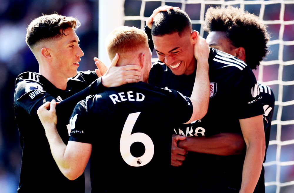 Harrison Reed and Harry Wilson celebrate Carlos Vinicius' goal