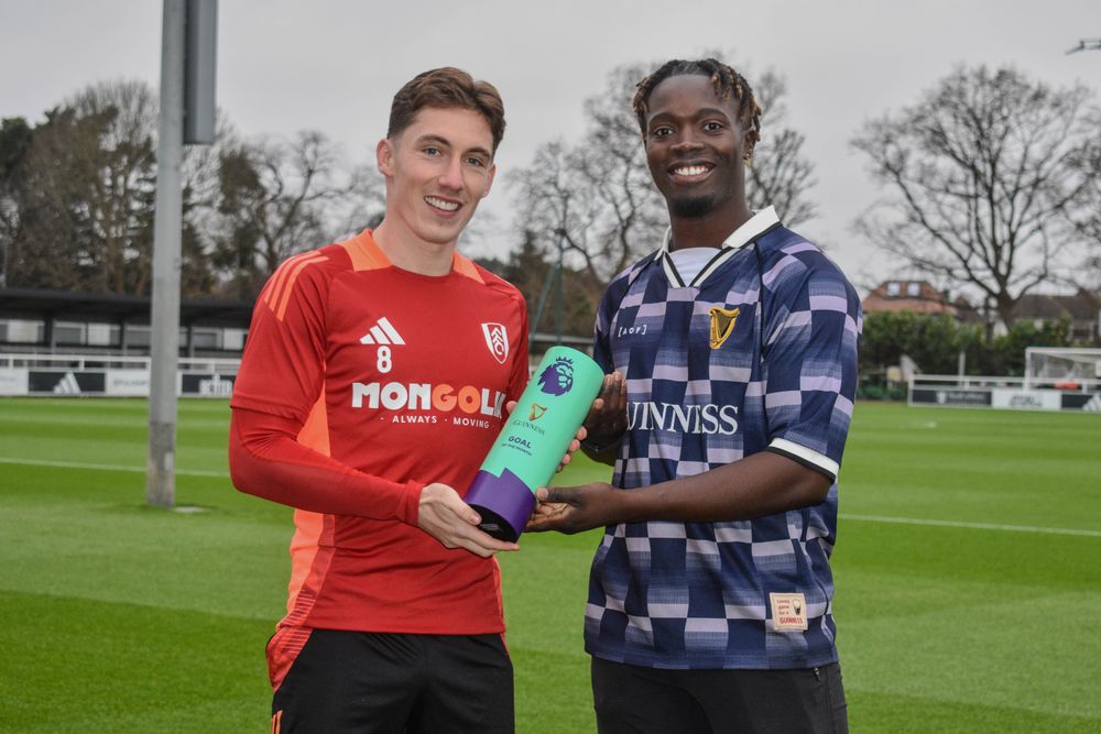 Guinness representative Kelvyn Quagraine presents Harry Wilson with his Goal of the Month trophy Guinness representative Kelvyn Quagraine presents Harry Wilson with his Goal of the Month trophy