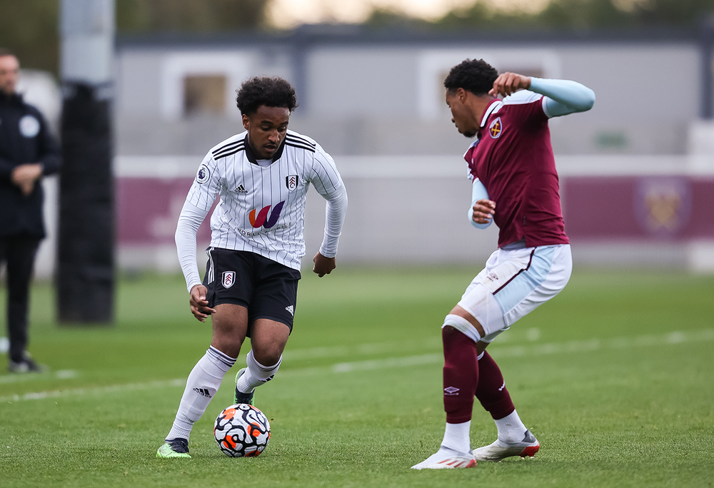 D'Auria-Henry dribbles at a West Ham man D'Auria-Henry dribbles at a West Ham man