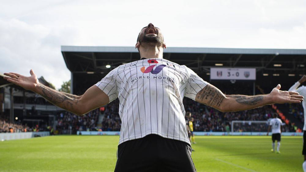 Aleksandar Mitrović celebrates scoring his hat-trick goal against West Brom