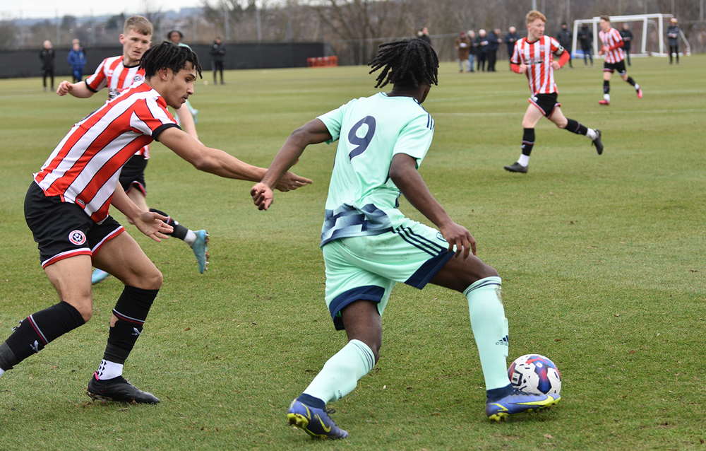 Loupalo-Bi shields off a defender