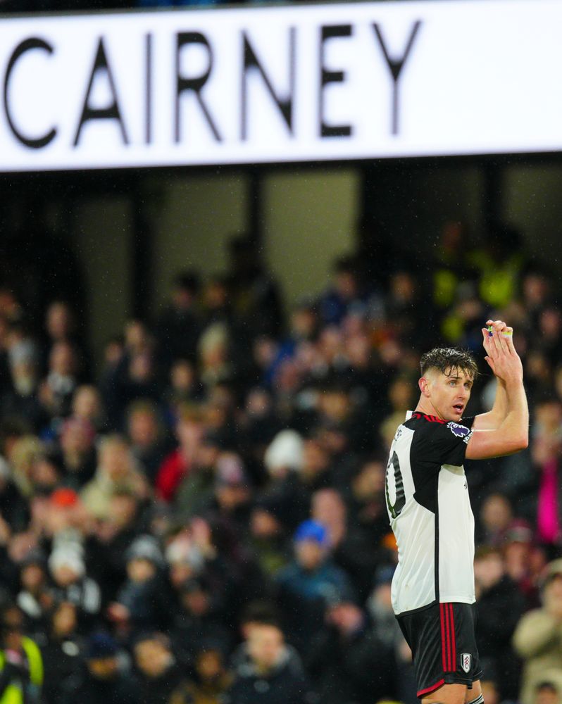 Tom Cairney applauds the Fulham fans