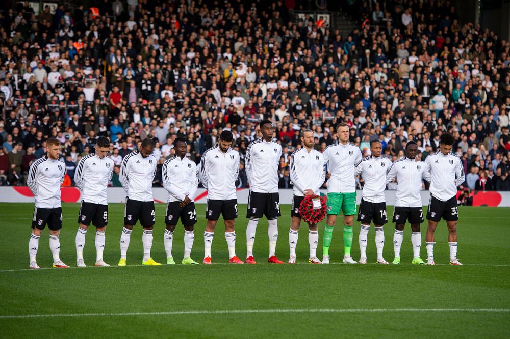 Fulham team all pay their respects before kick-off Fulham team all pay their respects before kick-off