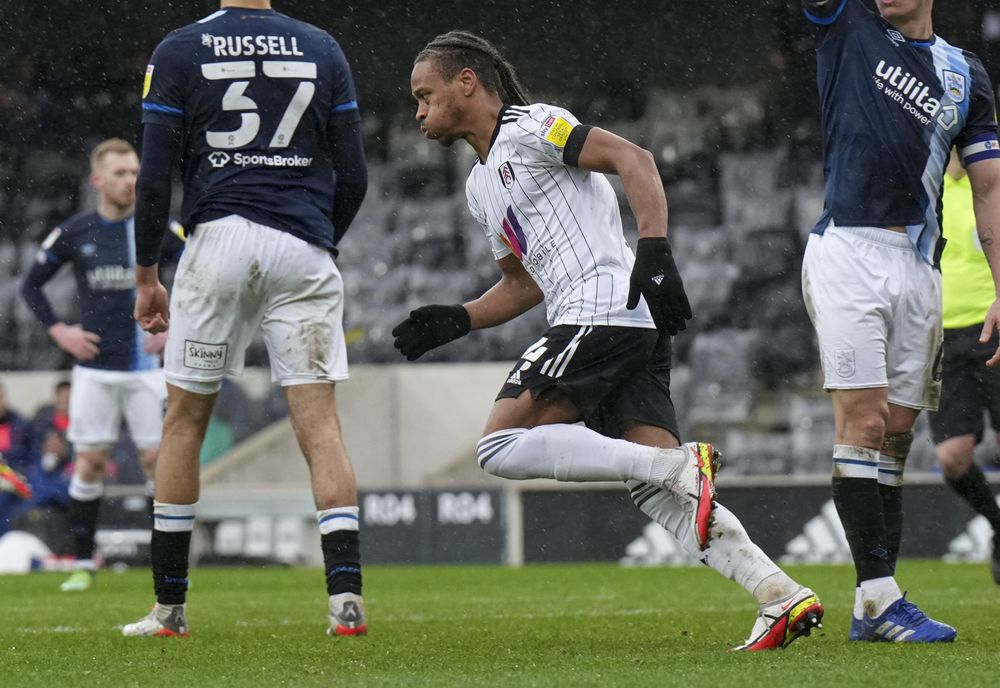 Bobby De Cordova-Reid wheels away after scoring against Huddersfield Town