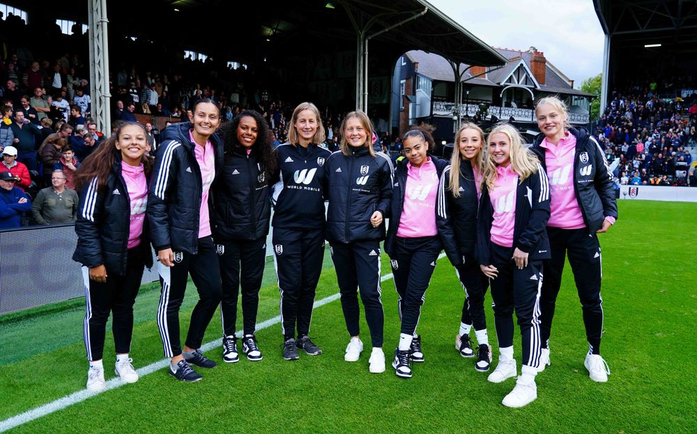 Members of Fulham Women on the pitch at Craven Cottage Members of Fulham Women on the pitch at Craven Cottage