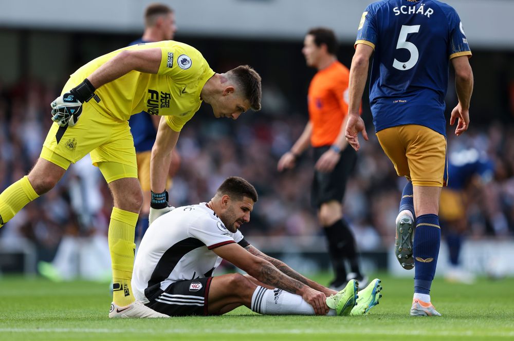 Aleksandar Mitrović goes down with an injury against Newcastle United