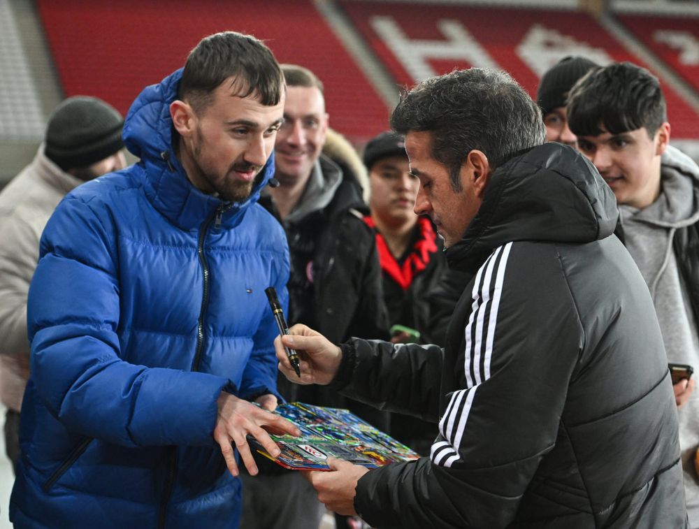 Marco Silva signs an autograph for a fan