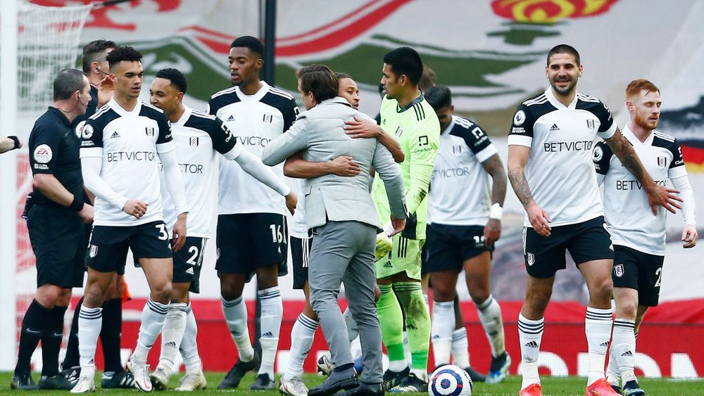 Scott Parker celebrates with his players at full-time at Anfield