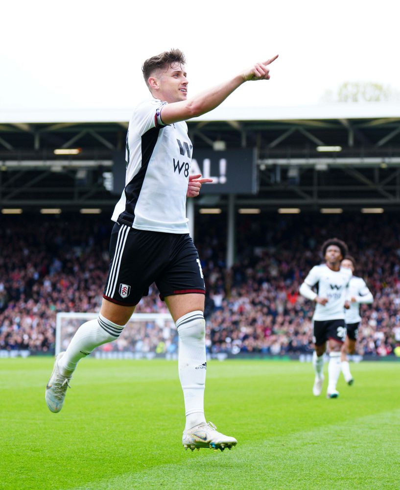 Tom Cairney celebrates scoring against Leicester