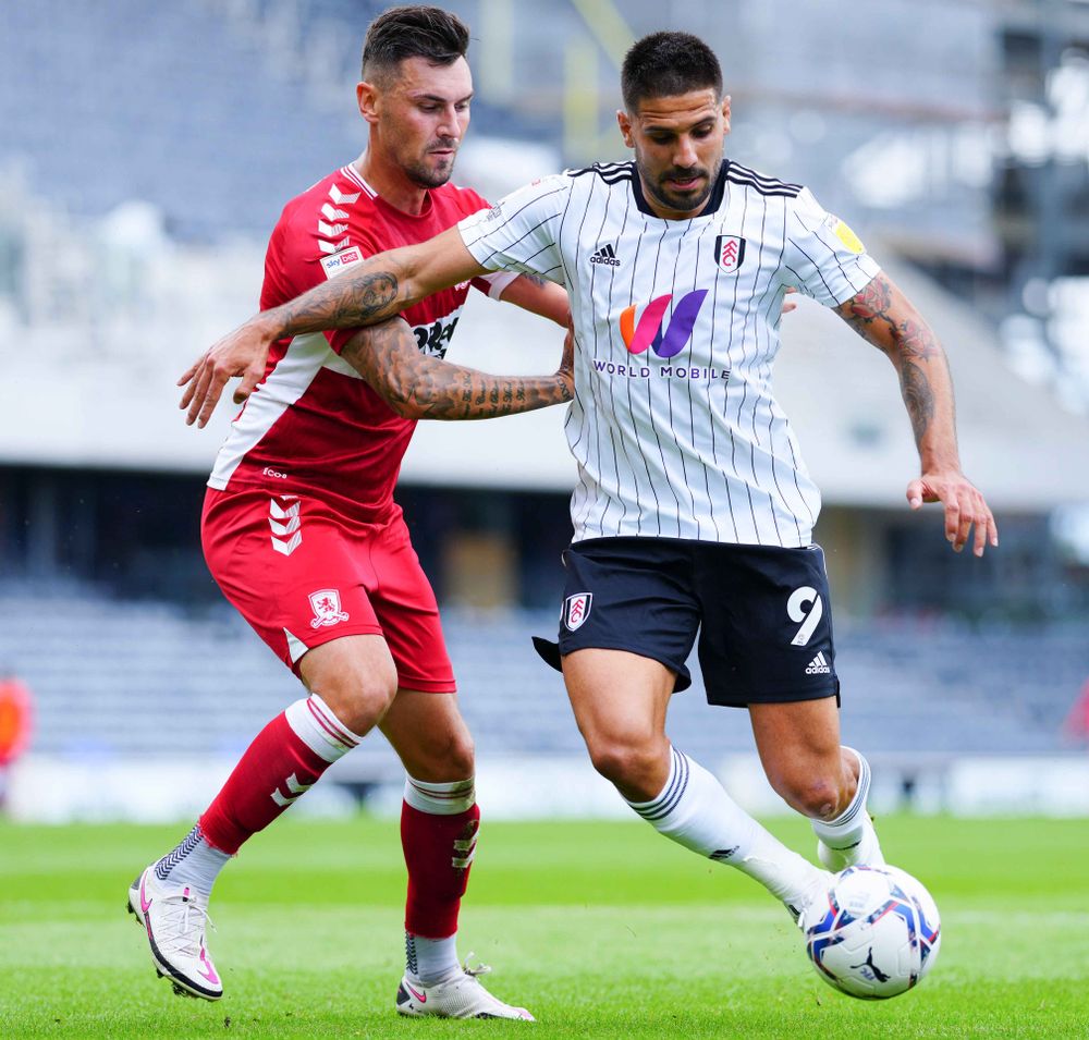 Mitro carries the ball forwards Mitro carries the ball forwards