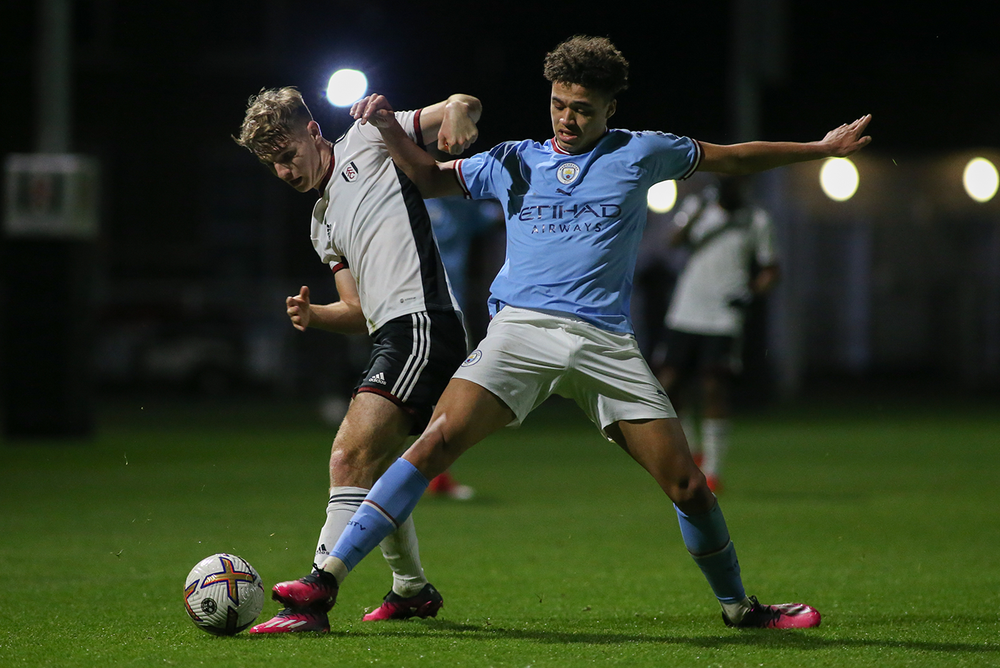 Mcfarlane battles for the ball