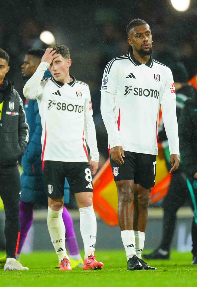 Alex Iwobi is dejected at full-time of Fulham's defeat by Wolves