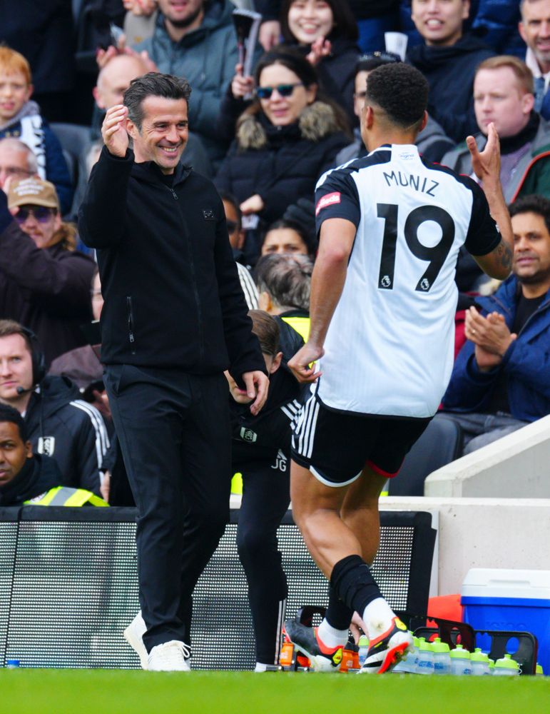 Marco Silva hugs Rodrigo Muniz