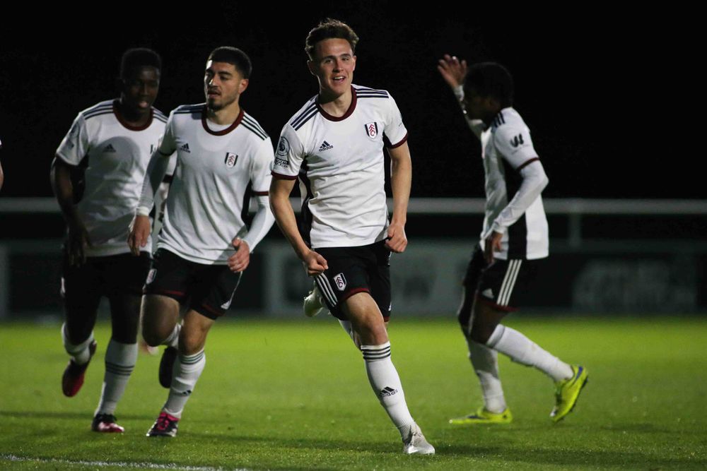 Luke Harris celebrates scoring against Arsenal