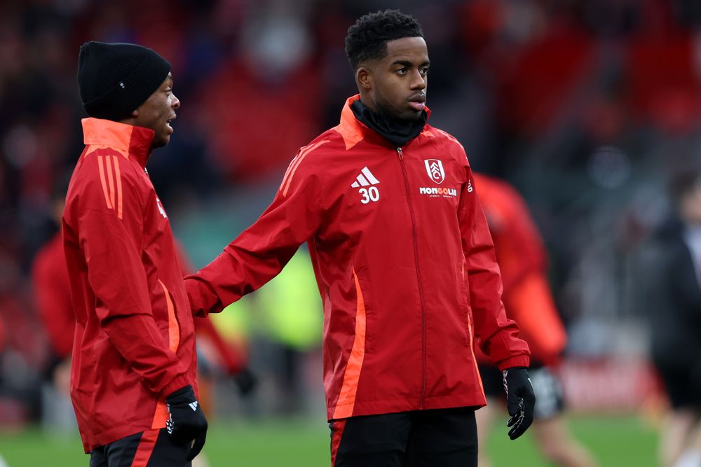 Martial Godo and Ryan Sessegnon warm up