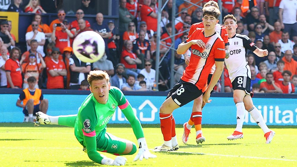 Fulham forward Harry Wilson looks to bend a shot past Luton goalkeeper Thomas Kaminski Fulham forward Harry Wilson looks to bend a shot past Luton goalkeeper Thomas Kaminski
