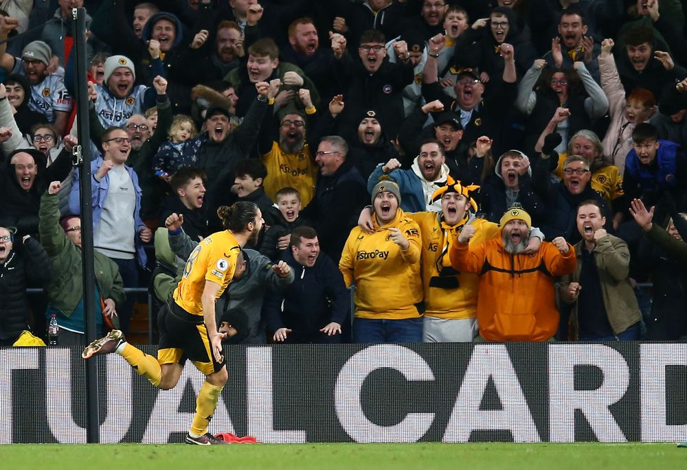 Ruben Neves celebrates scoring against Liverpool