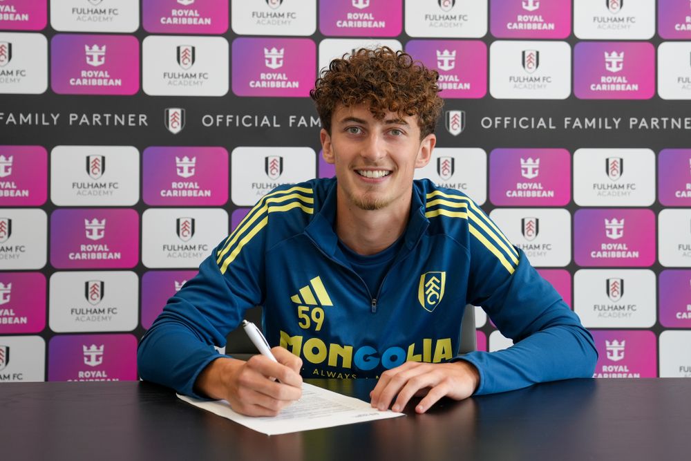 Tom Wingate signs his professional contract