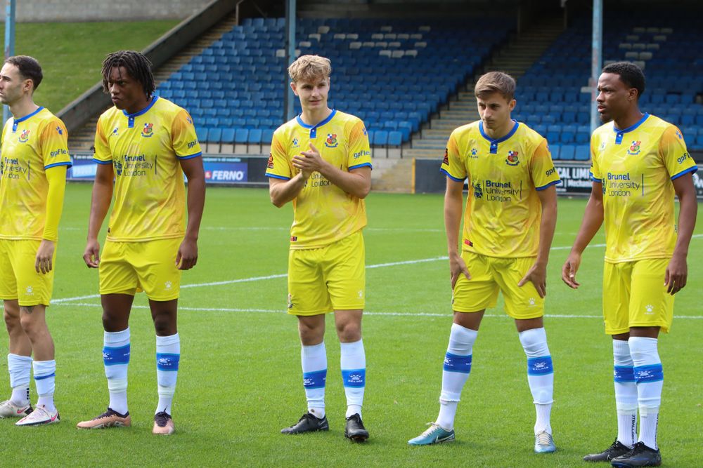 Callum McFarlane lines up with his Wealdstone team mates ahead of their game at Halifax Town