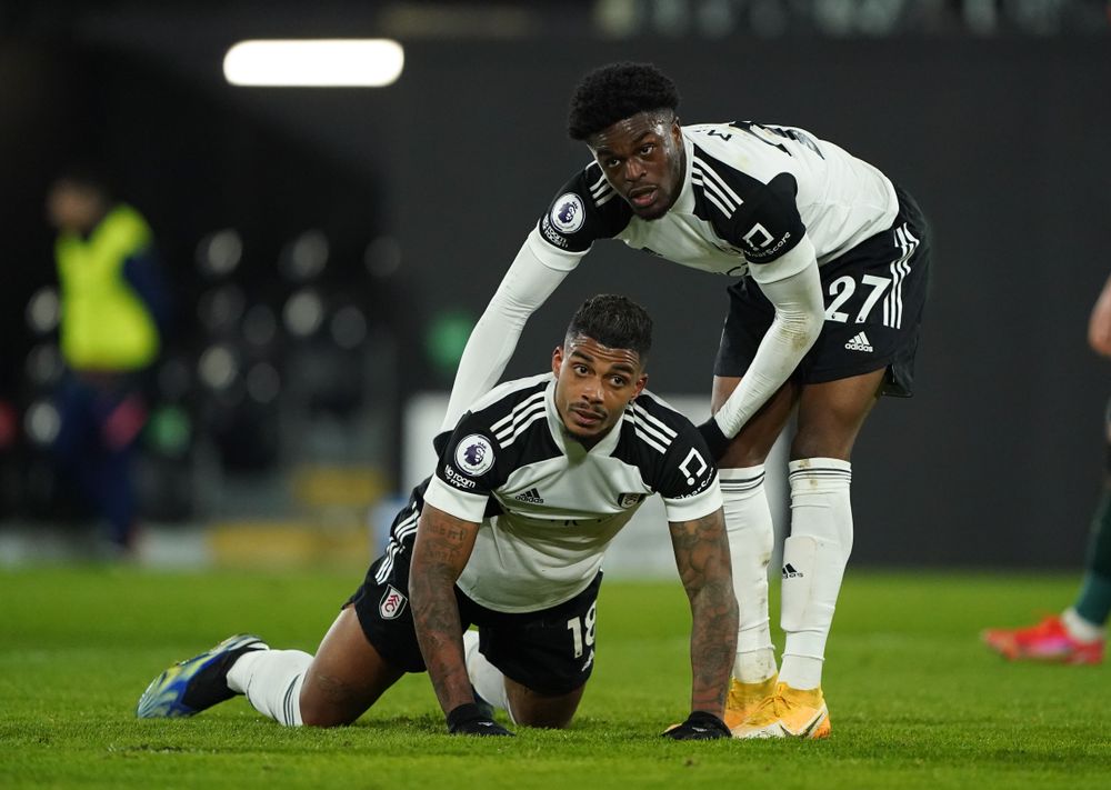 Mario Lemina is helped up by Josh Maja after narrowly missing a chance at the end of the first half. 