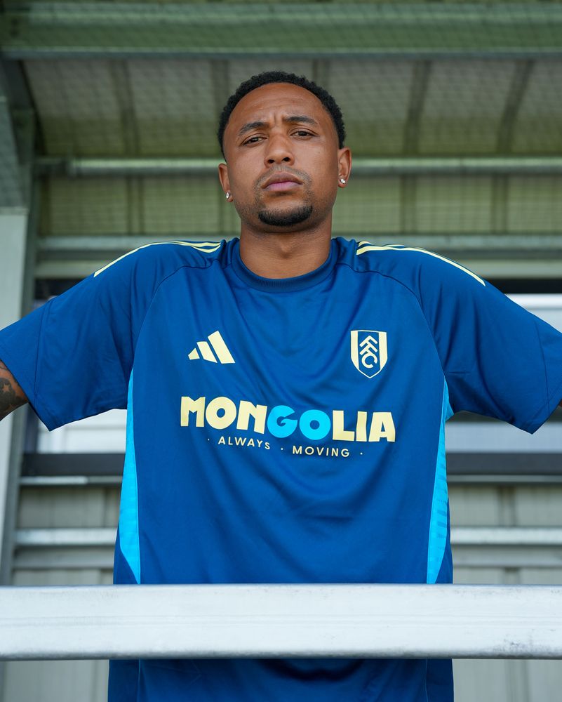 Kenny Tete poses in the new training kit after signing his new contract