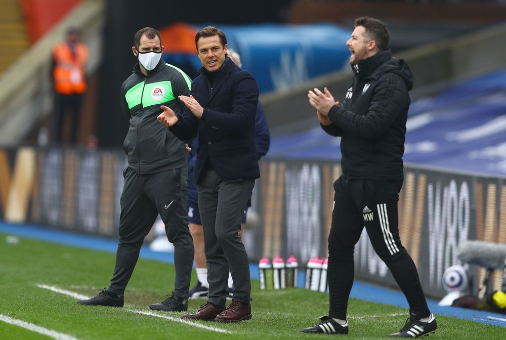 Scott Parker and Matt Wells applauds from the touchline