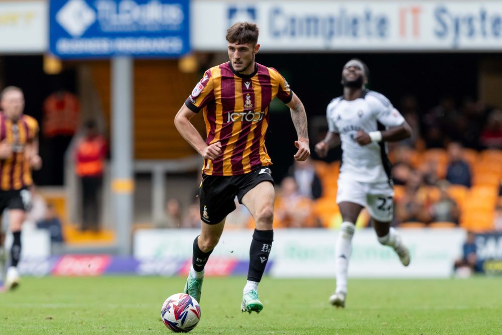 Olly Sanderson drives forward with the ball for Bradford City Olly Sanderson drives forward with the ball for Bradford City