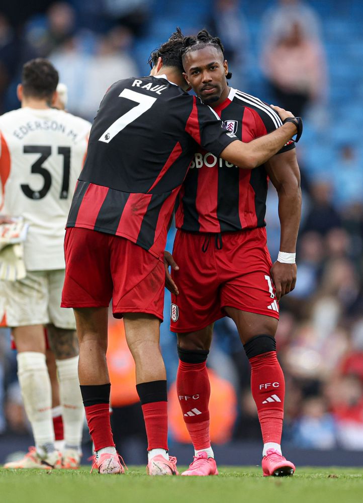 Raul Jimenez hugs Adama Traore