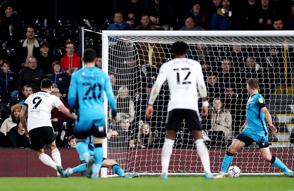 Aleksandar Mitrović tucks home the opening goal against Millwall Aleksandar Mitrović tucks home the opening goal against Millwall