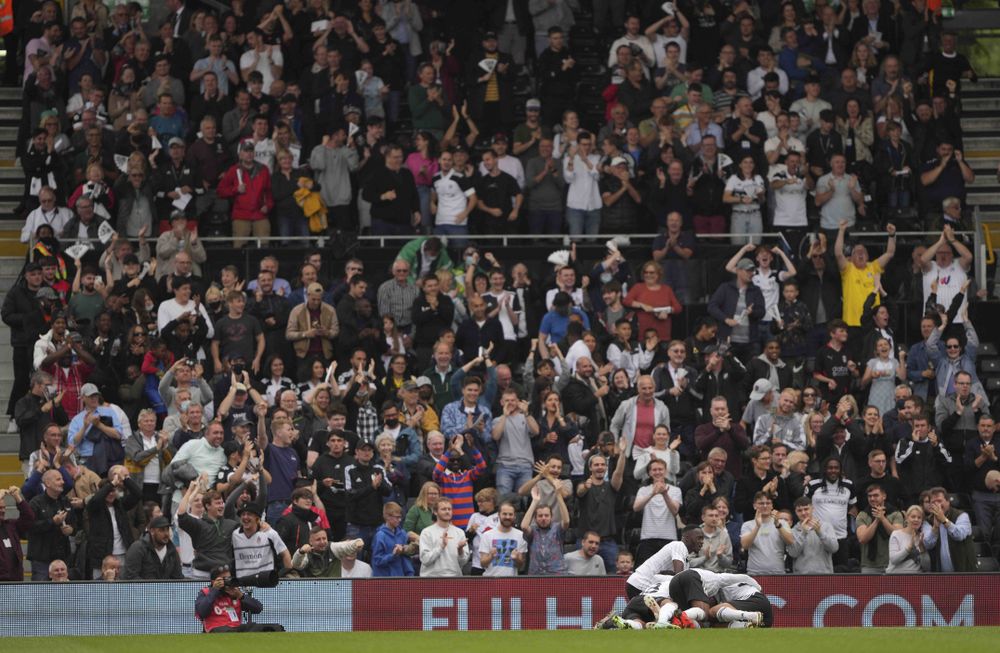 Fulham players and fans celebrate Harry Wilson's opener Fulham players and fans celebrate Harry Wilson's opener