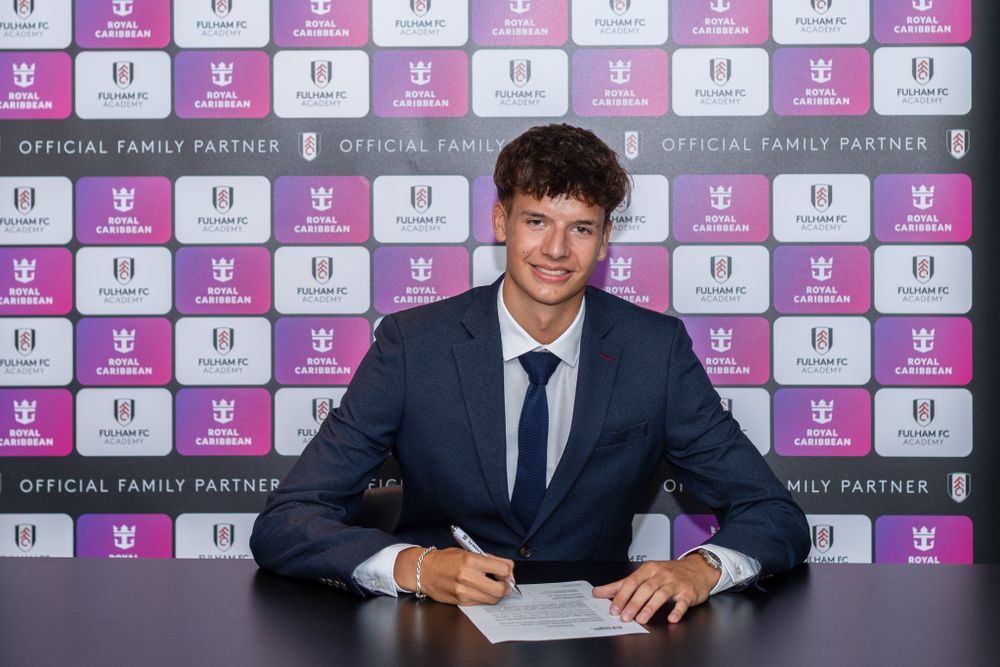 Matt Bagot signs his scholarship agreement