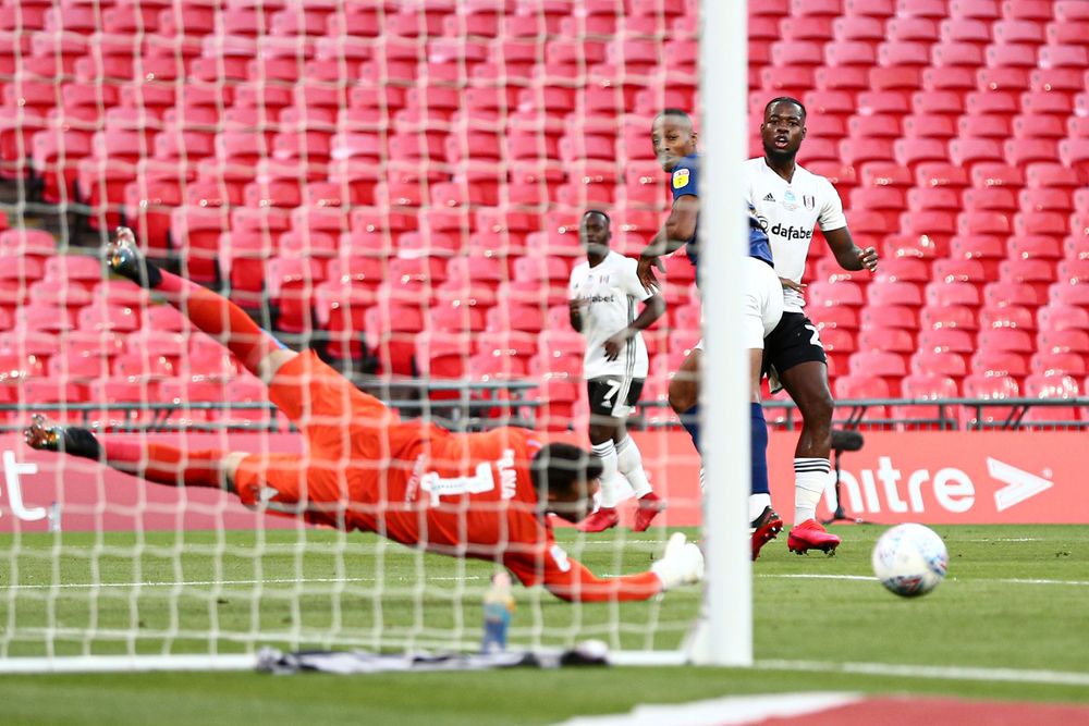 Josh Onomah sees his shot saved by David Raya in the Play-Off Final