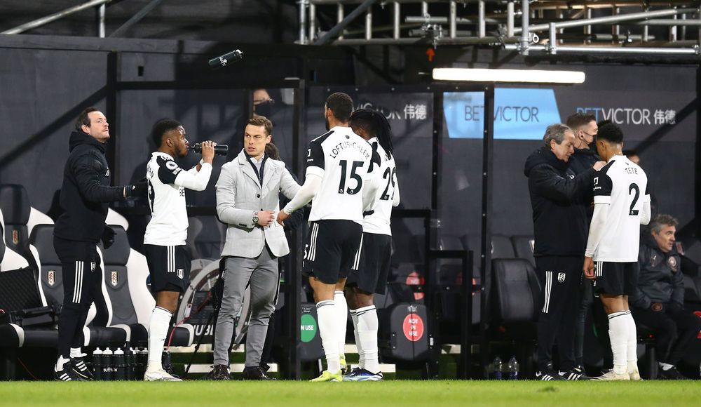 Scott Parker talks to his players in a break in play. Scott Parker talks to his players in a break in play.