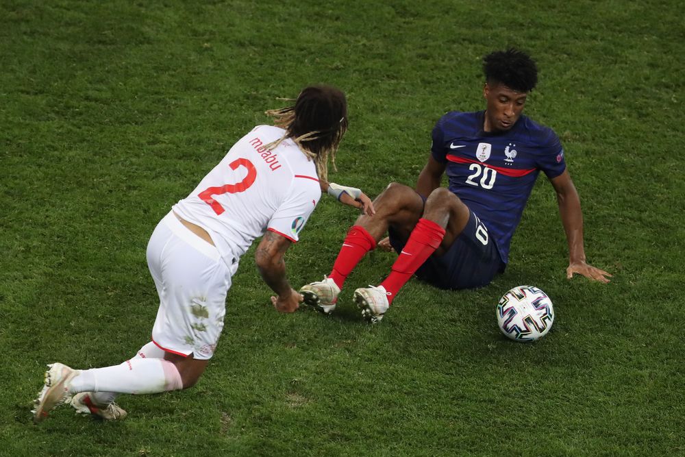 Kevin Mbabu gets beyond Kingsley Coman at the European Championship