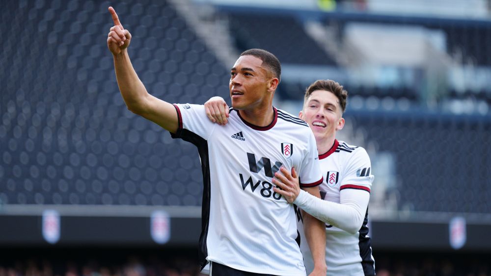 Carlos Vinicius celebrates with Harry Wilson