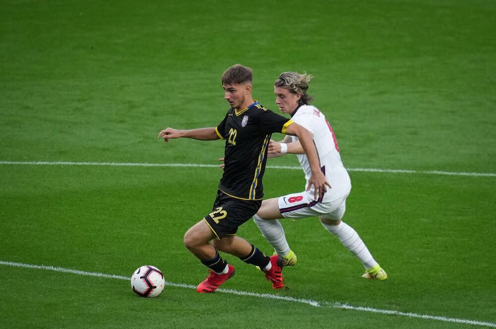 Adrion holds off England's Conor Gallagher Adrion holds off England's Conor Gallagher