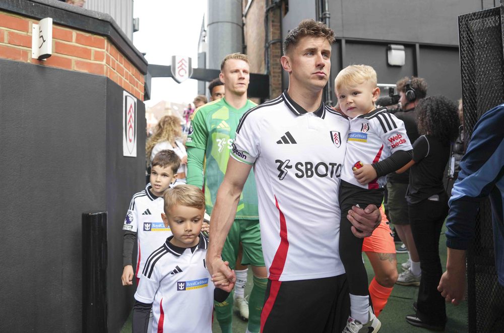 Tom Cairney leads the side out Tom Cairney leads the side out